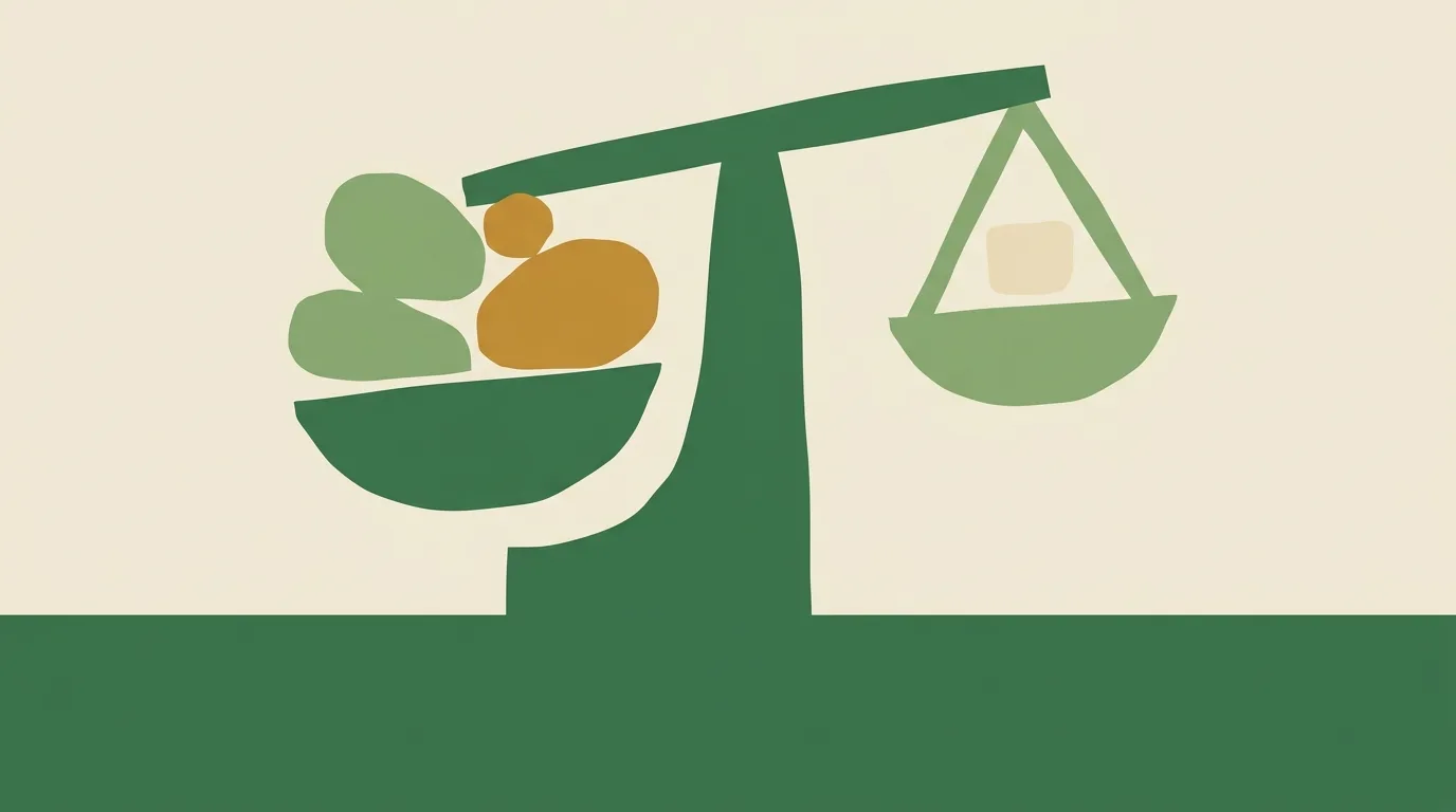A green balance holding colored circles opposite a triangular weight.